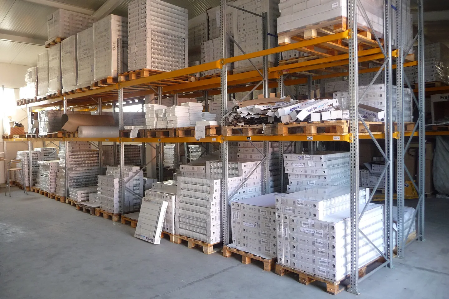 Radiators and wrapped stock stored on steel pallet racks