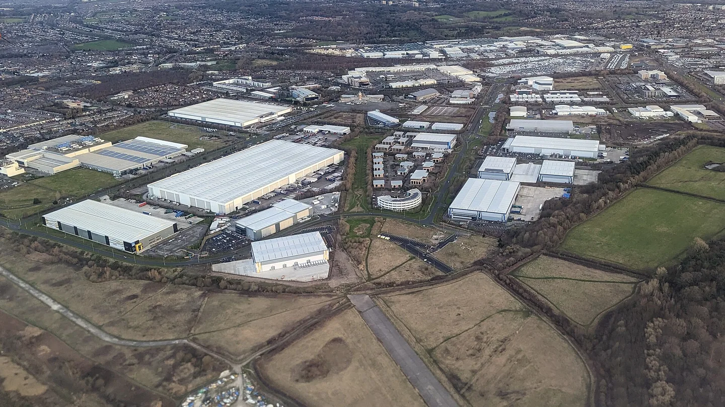 Aerial view of large distribution warehouses and surrounding roads