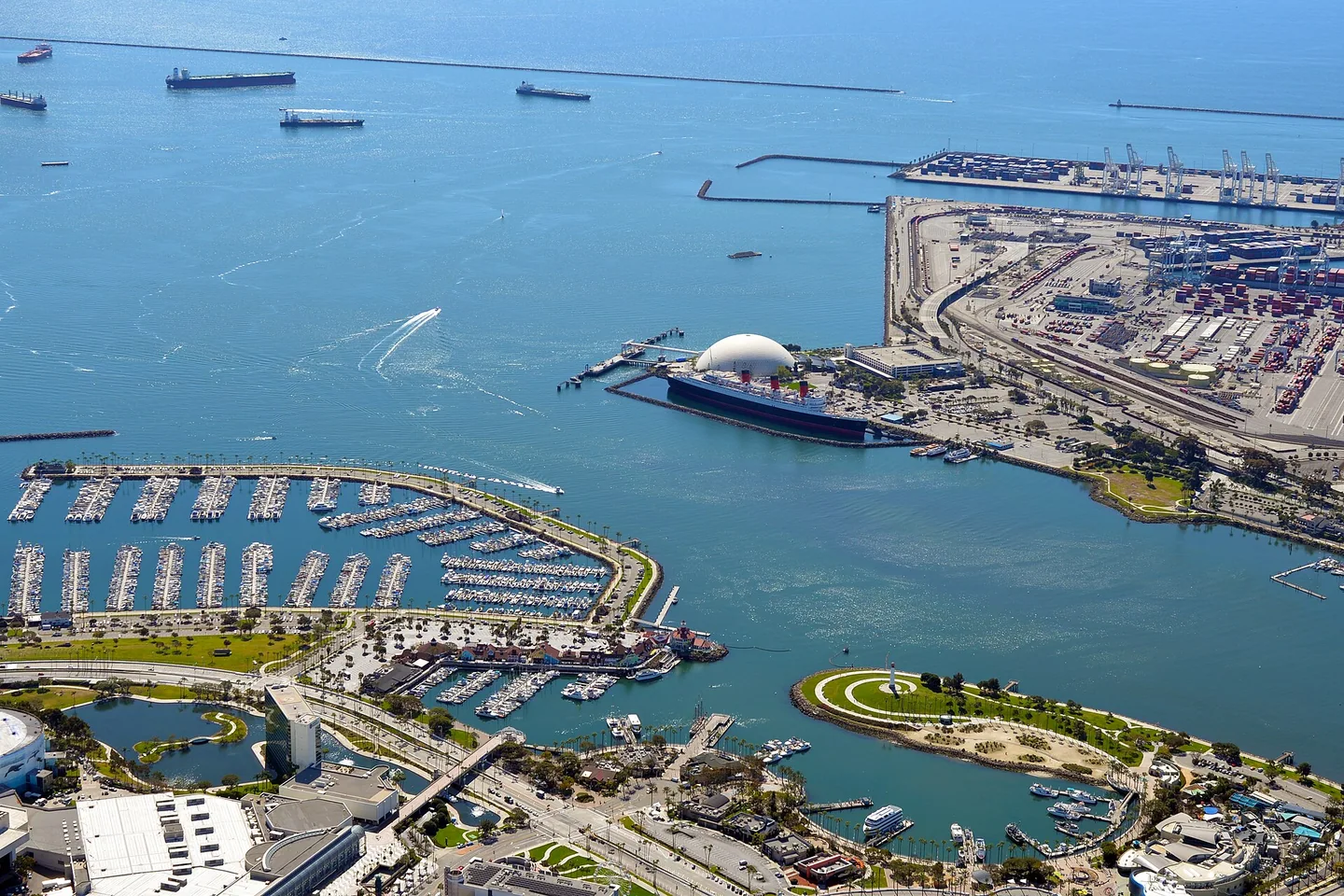 Aerial view of a coastal container port with quays yards and ships
