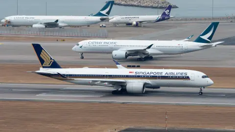 Several passenger aircraft at different distances across an airport apron