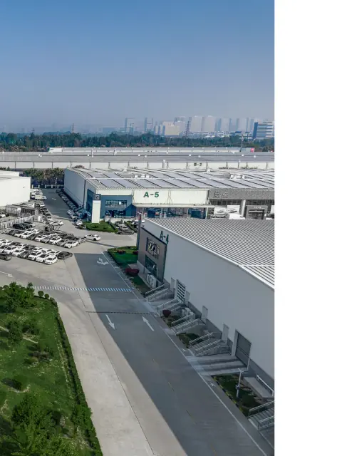 Aerial view of a logistics park roadway between warehouse buildings