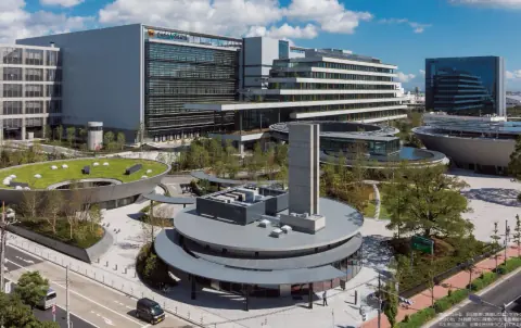 Urban logistics complex with glazed offices and a circular rooftop structure