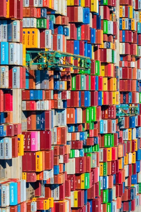 Dense rows of multicoloured shipping containers seen from above