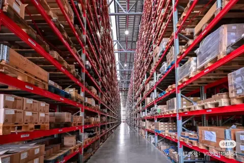 Long red-rack warehouse aisle with densely stored cartons