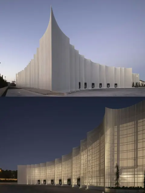 Paired views of a curved translucent warehouse facade