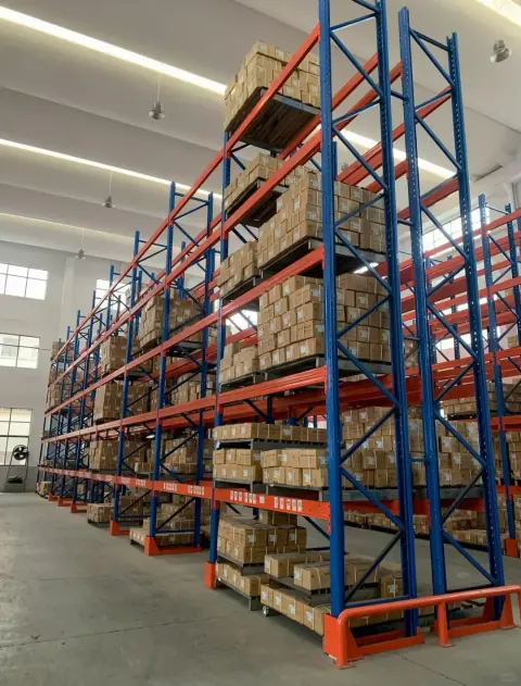 Blue and orange heavy-duty pallet racks in a warehouse hall