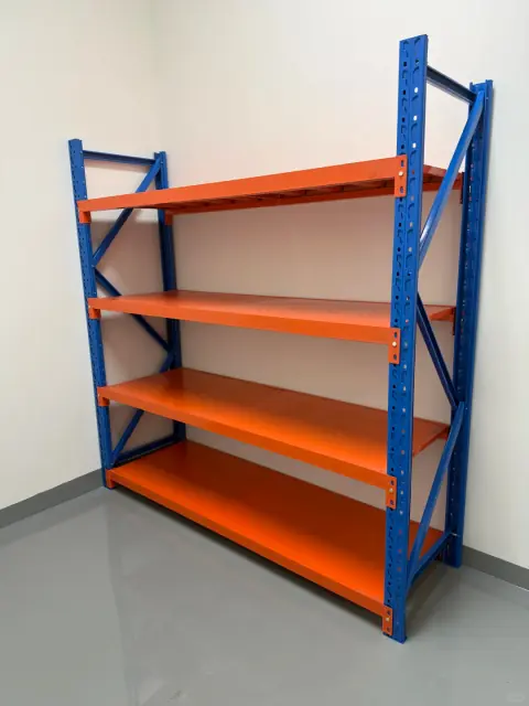 Freestanding orange and blue industrial shelving unit