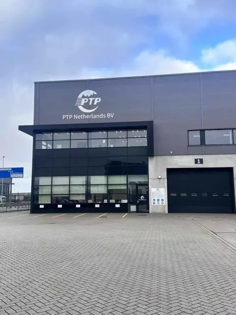 Warehouse entrance with dark cladding and glazed office frontage